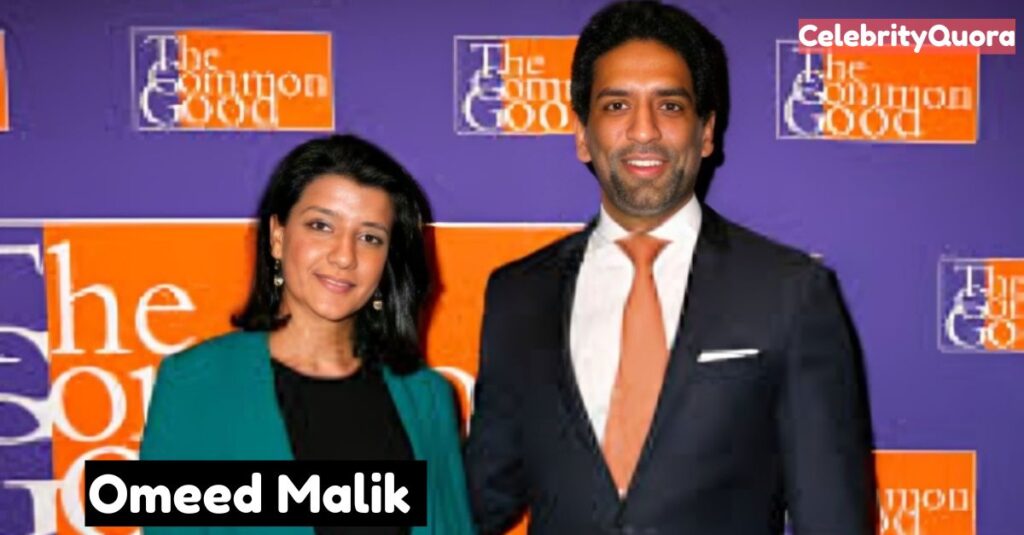 Omeed Malik and a woman posing at an event.