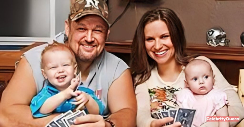 A family portrait of Larry the Cable Guy, his wife, and their two young children sitting together, holding playing cards. Larry is holding a smiling toddler boy and his wife is holding a baby girl.