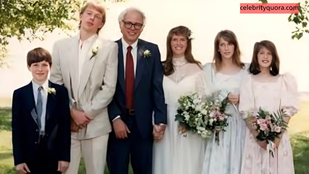 A vintage photo of Bernie Sanders with his family, including his wife and children, posing outdoors for a portrait. Bernie wears a blue suit, and his wife is in a white dress, holding a bouquet of flowers.